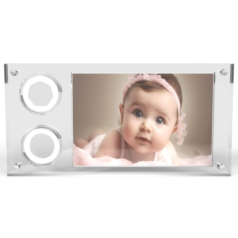 Framed photo of a baby in pink.