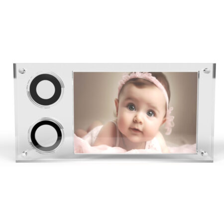 Baby in pink headband on photograph display.
