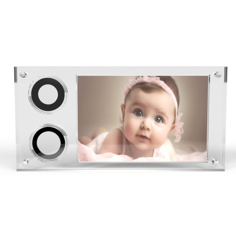 Baby in pink headband on photograph display.