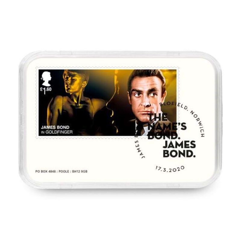 James Bond Goldfinger commemorative stamp in display case.